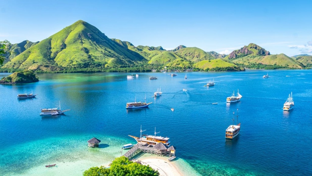 Picturesque sea lagoon with islands, azure water, and ship